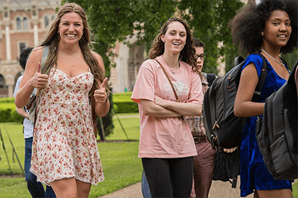 Undergraduate students walking through the academic quad